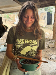 Guest holding freshly prepared cacao beans during Local Cacao Workshop in Chicanuz Village