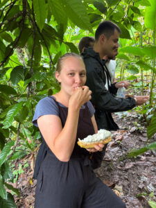 Guest tasting fresh cacao fruit during Local Cacao Workshop in Chicanuz Village
