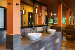 Shared bathroom sinks and mirrors in Cayala mixed dorm at Greengo’s Guatemala