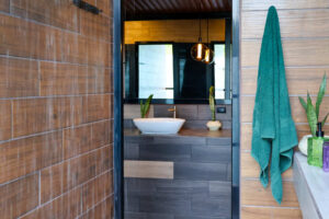 Shared shower area with mountain views in Cayala mixed dorm bathrooms