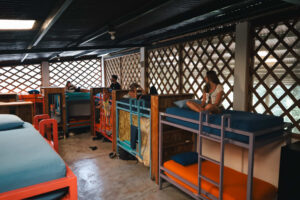 Social mixed dorm with bunk beds and lockers in the Noisy Dorm at Greengo’s Hotel