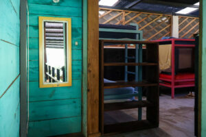 Entrance to the Noisy Dorm with shared bunk bed accommodations at Greengo’s Guatemala