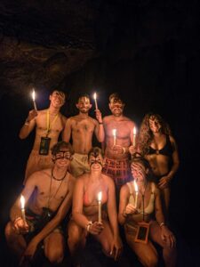 Friends enjoying candlelit cave exploration during K’anba Cave Tour near Greengo’s