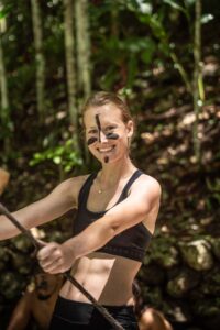 Guest with traditional face paint during K’anba Cave adventure near Semuc Champey