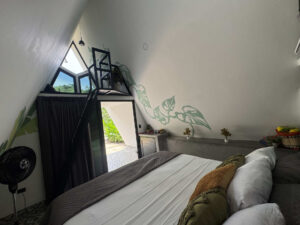 Loft and king bed layout inside modern Garden Cabaña at Greengo’s Hotel