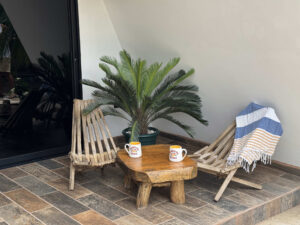 Private balcony seating area outside Garden Cabaña surrounded by tropical greenery