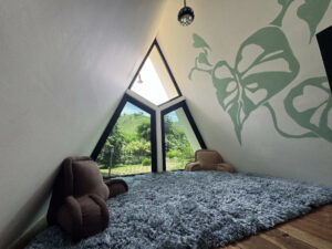 Upstairs reading loft with mountain views inside Garden Cabaña private room