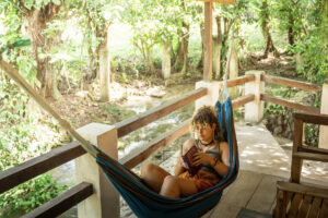 Riverfront balcony hammock outside Riverside Room at Greengo’s Hotel Guatemala