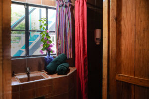 Riverfront private room with natural light and jungle-inspired decor in Riverside Rooms