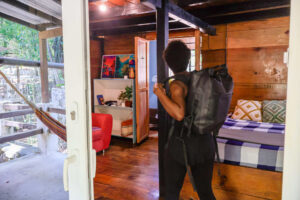 Private Riverside Room with queen bed and cozy wooden design at Greengo’s Guatemala