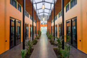 Modern courtyard walkway through El Barrio semi-private rooms at Greengo’s