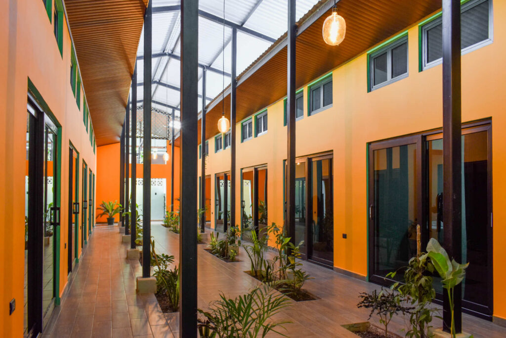Modern El Barrio semi-private rooms with colorful courtyard design at Greengo’s Guatemala