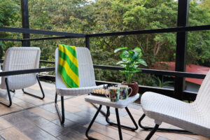 Private balcony seating area with mountain views at Nomads semi-private rooms