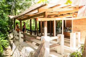 Semi-private Cozy Nook room with riverfront balcony and wooden jungle-style design at Greengo’s