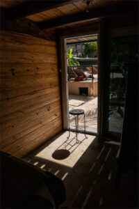 Entrance to Cozy Nook semi-private room with sliding glass doors and jungle views