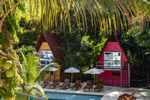 Poolside loft cabañas surrounded by tropical jungle at Greengo’s Guatemala