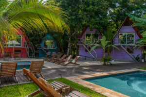Original wooden loft cabañas beside the pool at Greengo’s Hotel Guatemala